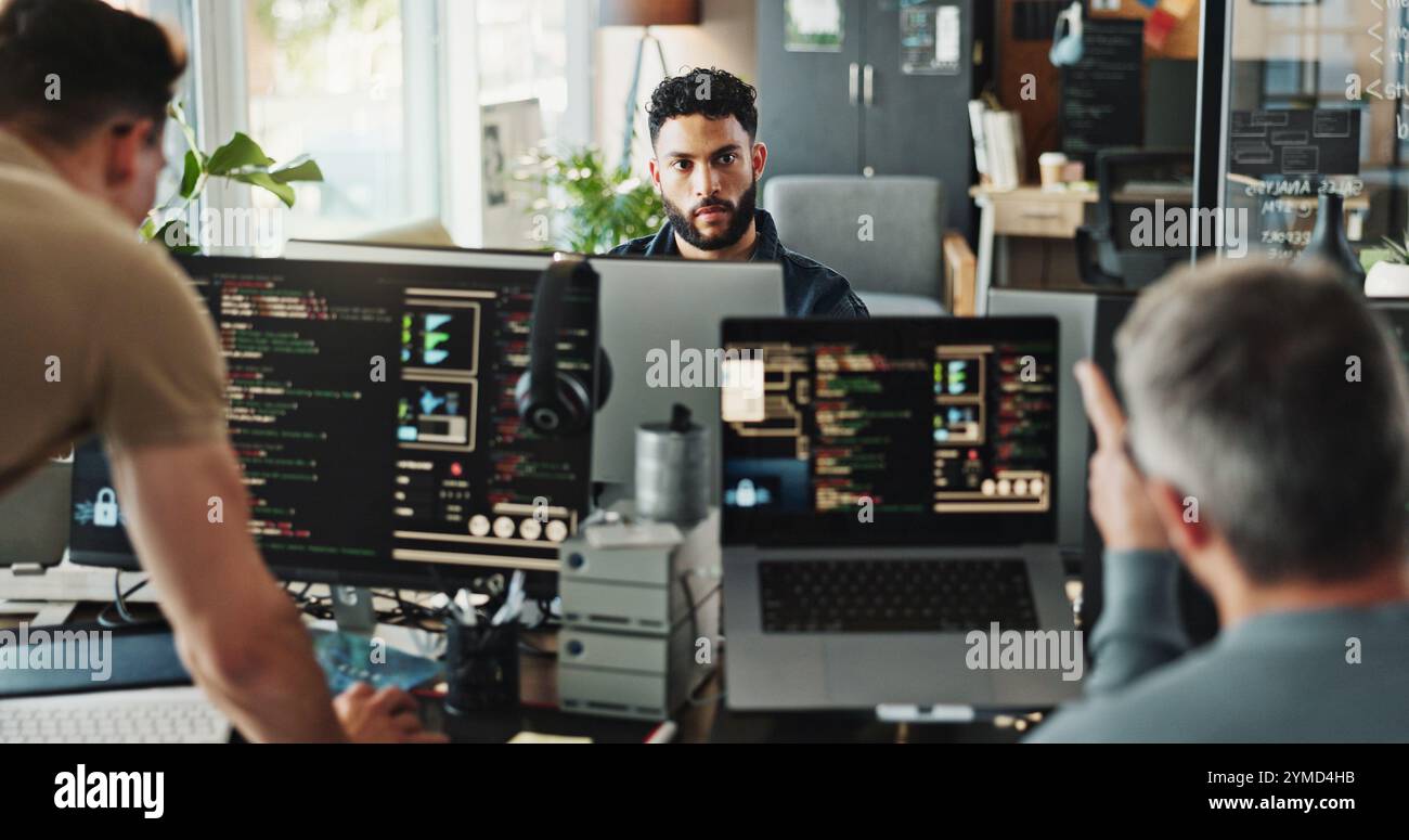 Man, developer and programmer with computer for coding solutions, problem solving or ideas at office. Male people, designers or employees working on Stock Photo