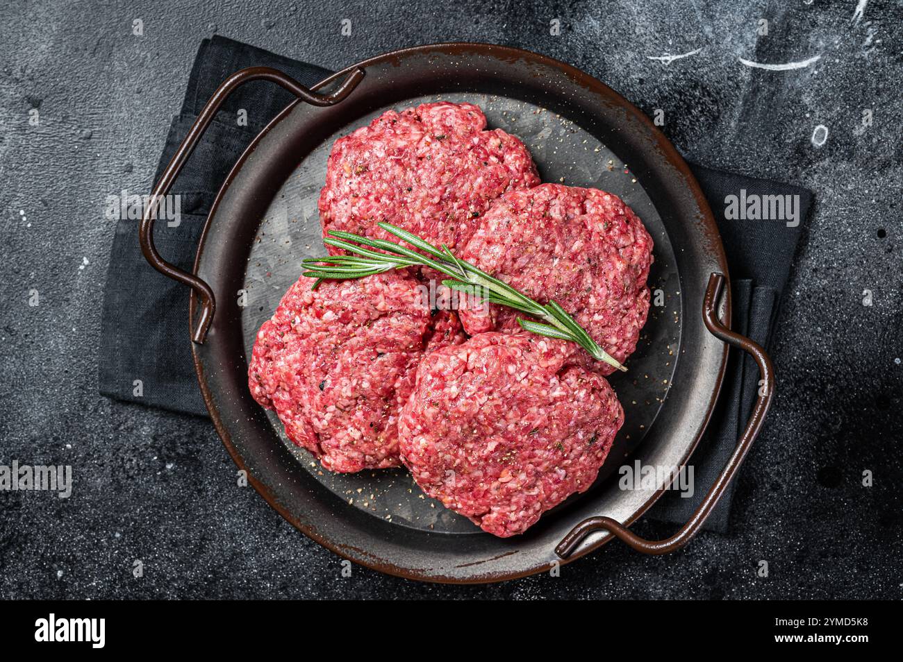 Frickmeat Uncooked Frikadellen from Mince beef Meat, raw meat cutlets. Black ...