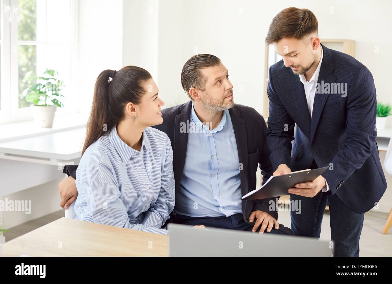 Advisor explaining terms couple hi-res stock photography and images - Alamy