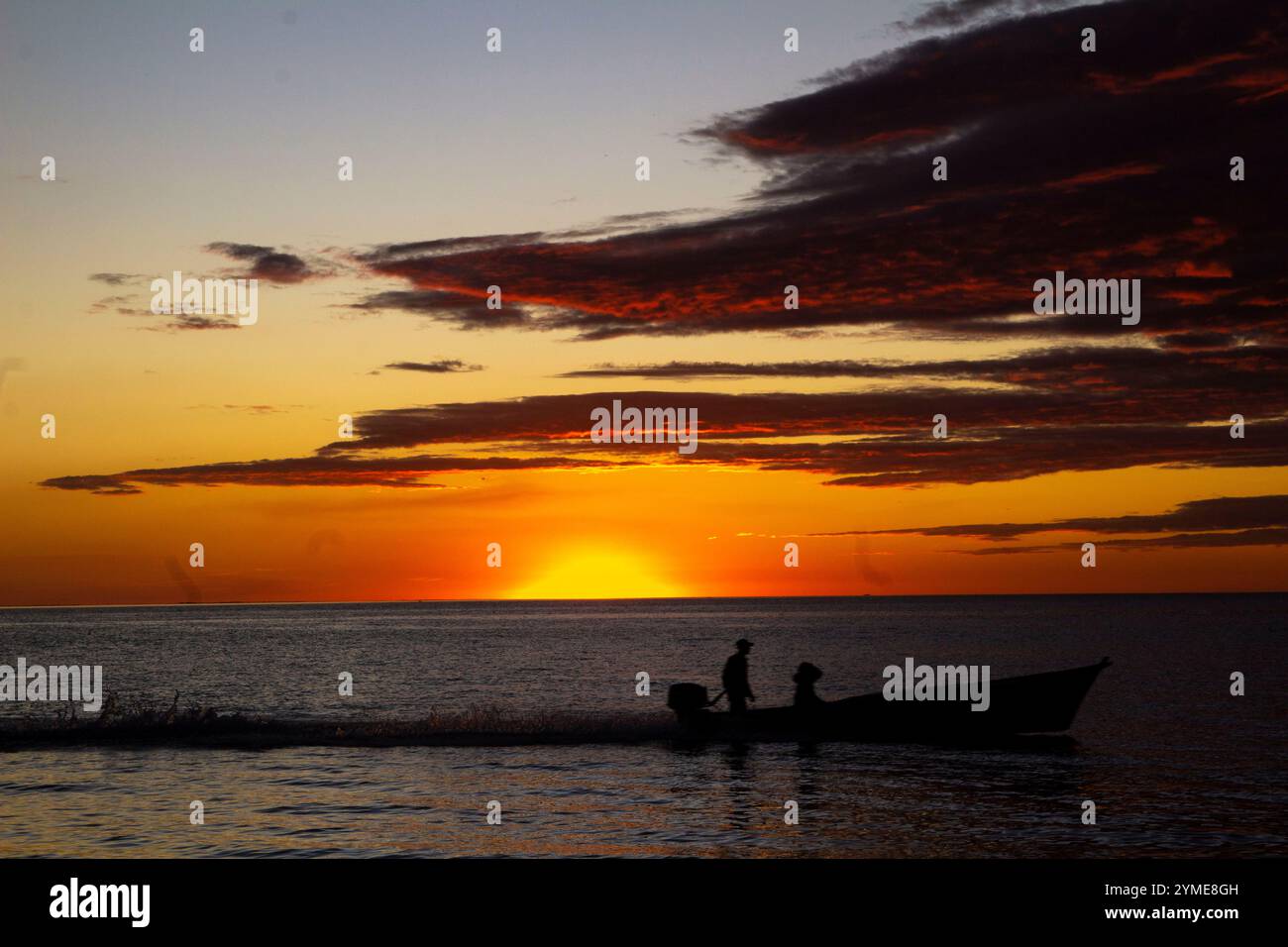Sunset tree boat silhouette hi-res stock photography and images - Alamy