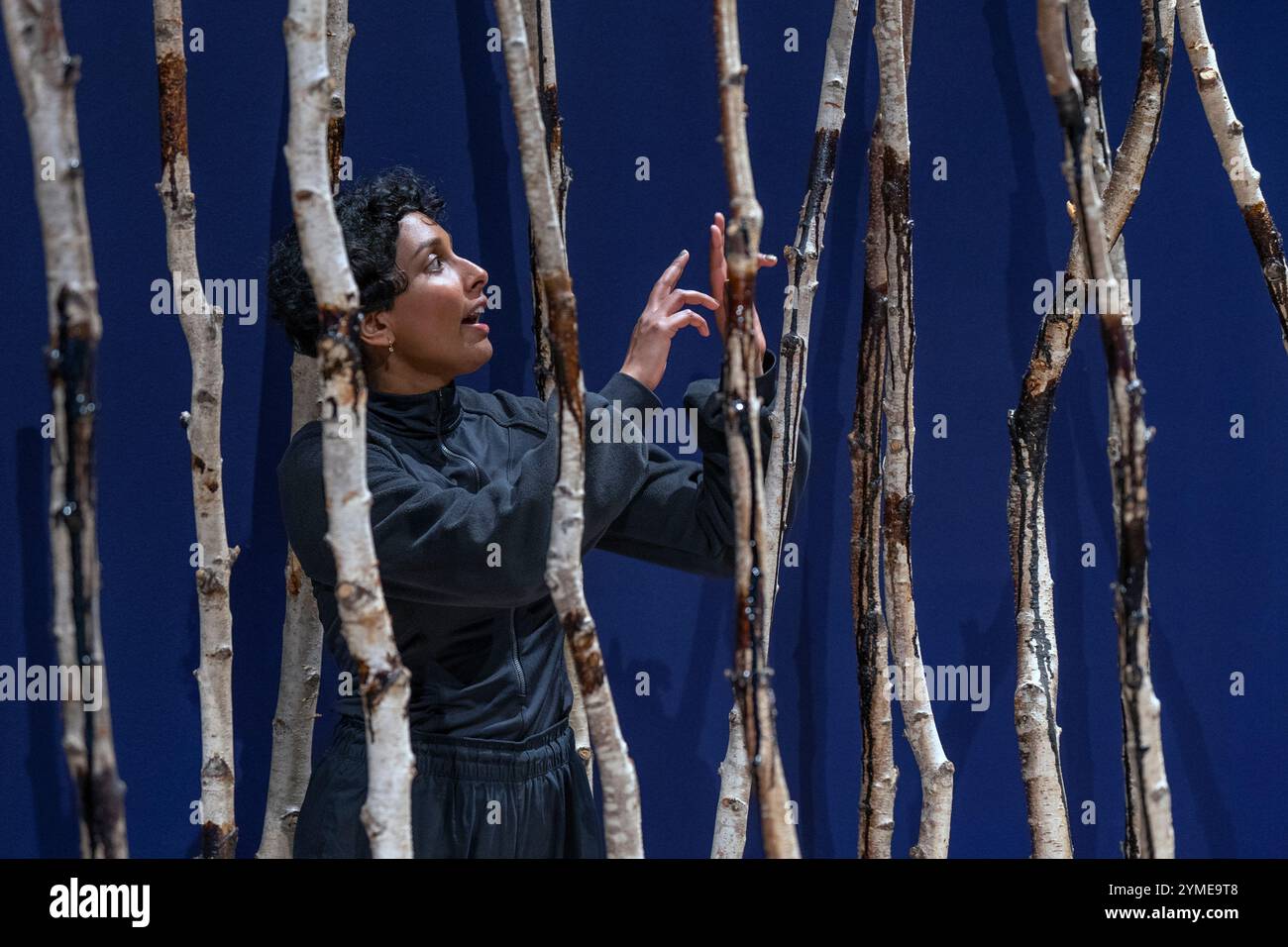 Artist Hamshya Rajkumar alongisde her artwork Extraction 2023, which ...