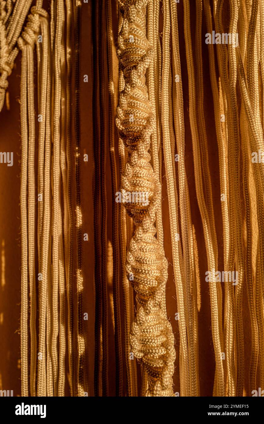 Macrame curtains in the evening light Stock Photo