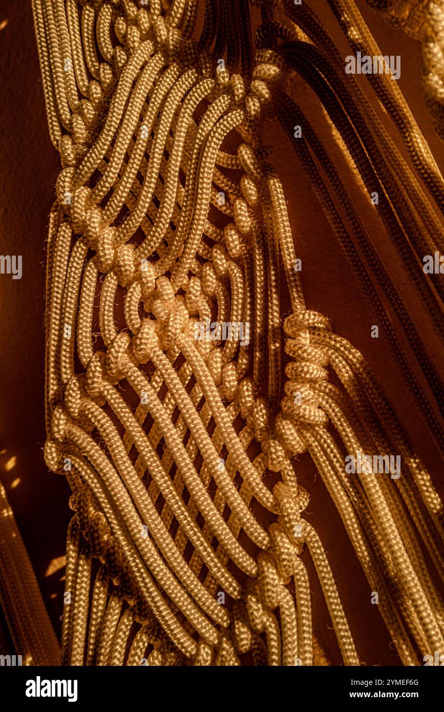 Macrame curtains in the evening light Stock Photo