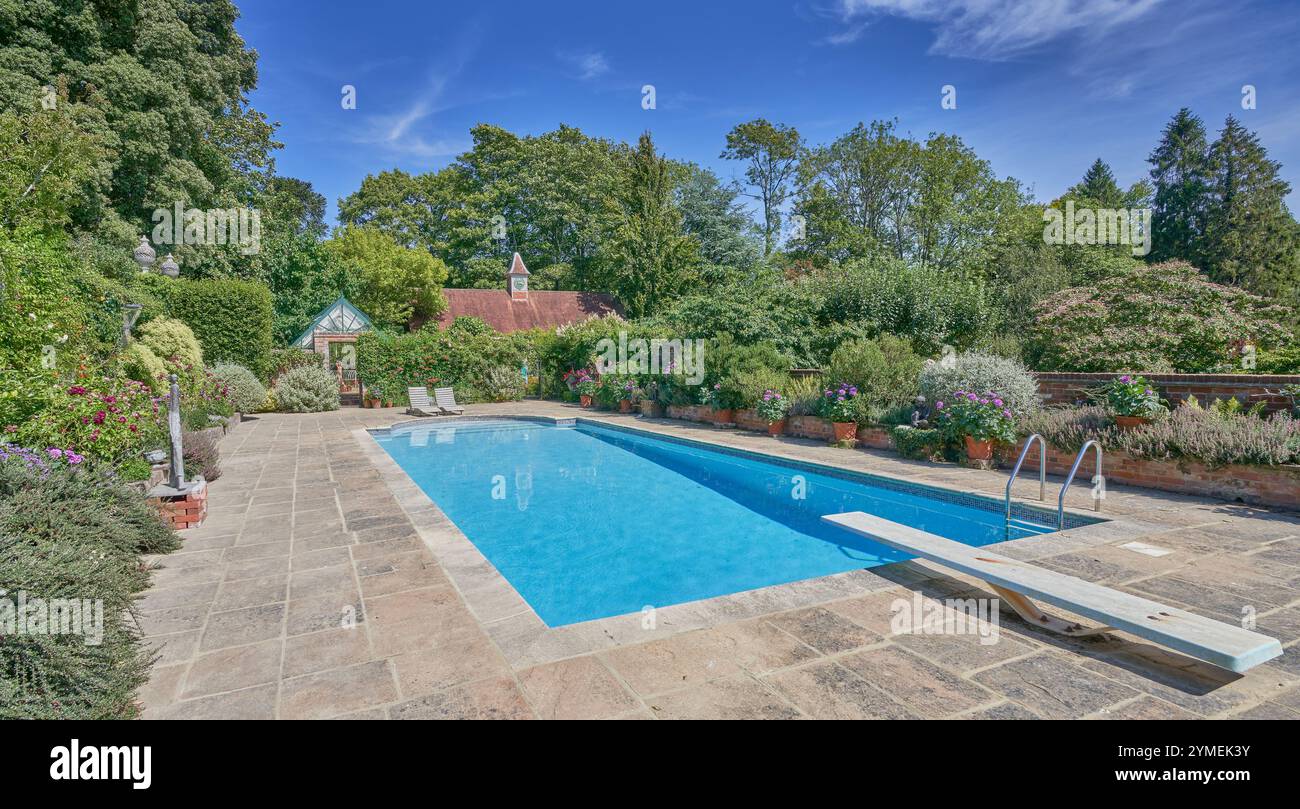 Luxury swimming pool in a large classic English garden Stock Photo - Alamy