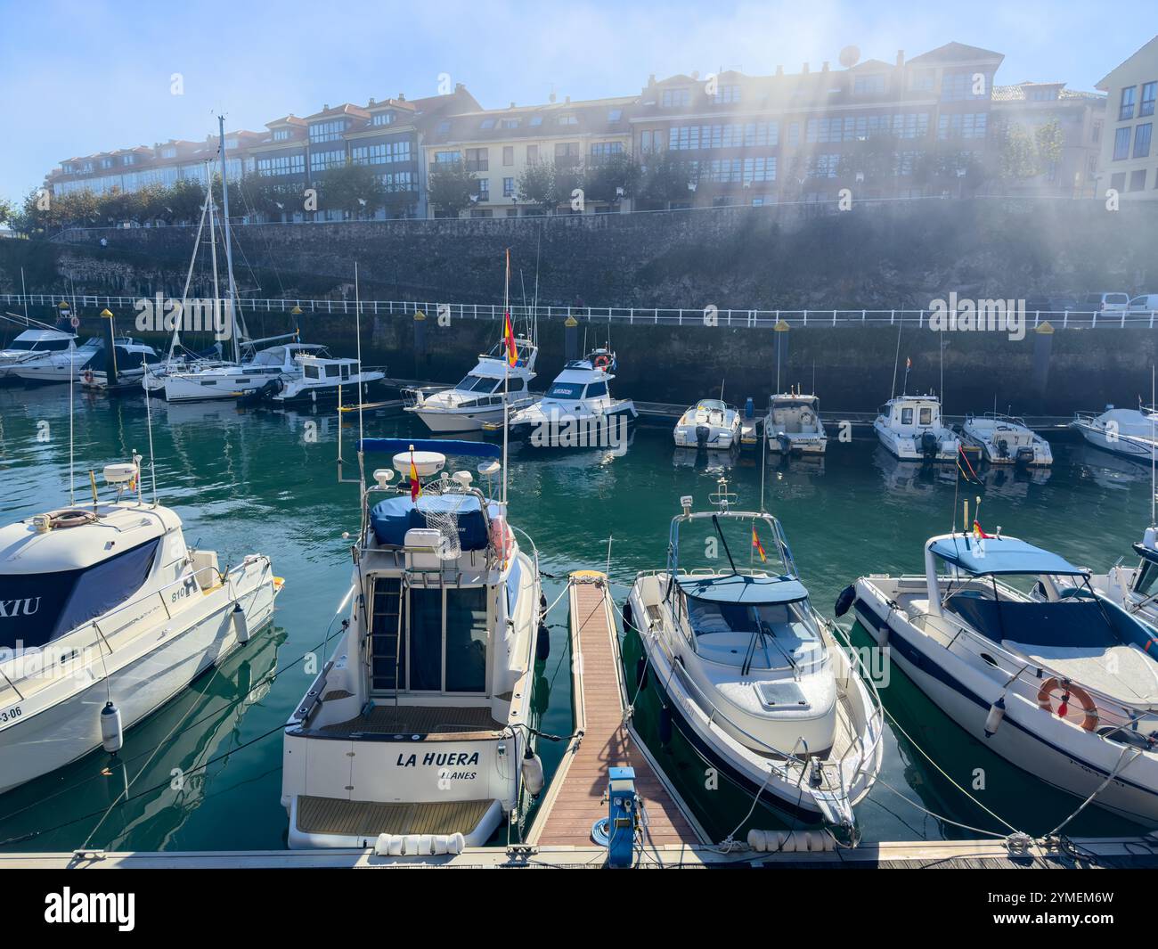 Yachts moored during a misty day in the marina of Llanes, Asturias, Spain - Smartphone Captured Stock Image