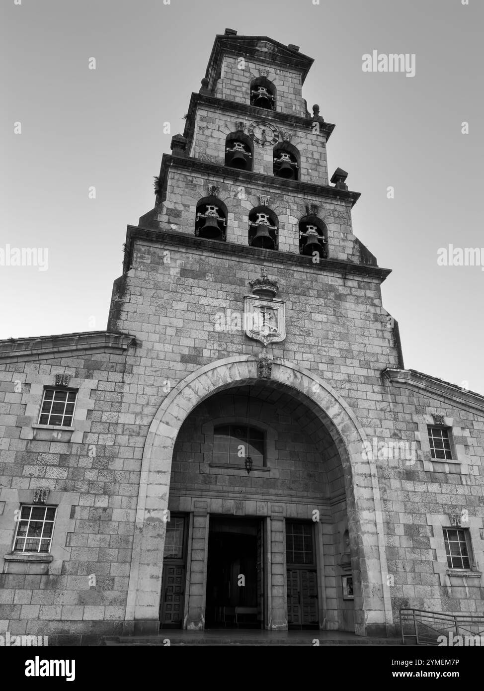 The magnificent bell tower of the church of Santa María de la Asunción in the old town of Cangas de Onís, Asturias, Spain - Smartphone Captured Stock Image