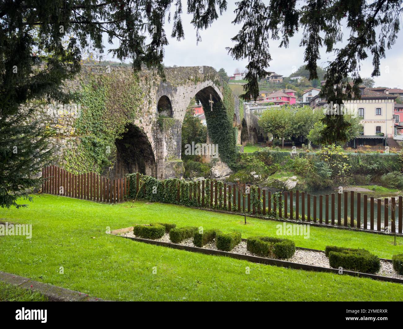 Roman Bridge with the Victory Cross (Asturias symbol) over the River Sella in the town of Cangas de Onís, Asturias, Spain - Smartphone Captured Stock Image