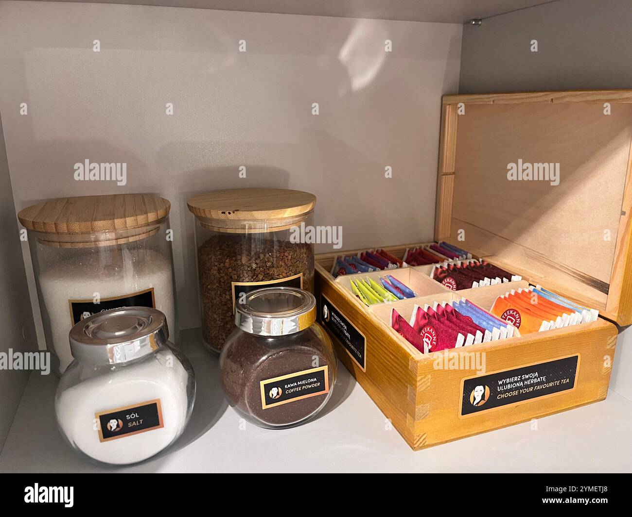 Selection of coffee and box of teabags supply for short term stay apartment for rent accommodation in Poland, Europe, EU - Smartphone Captured Stock Image