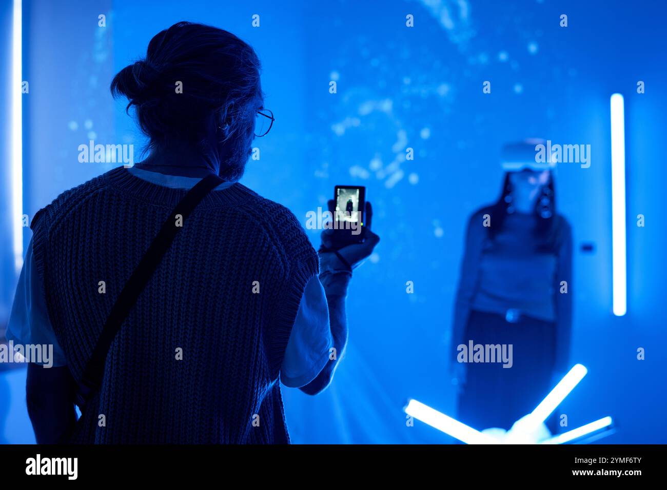 Person capturing immersive virtual reality experience with smartphone ...