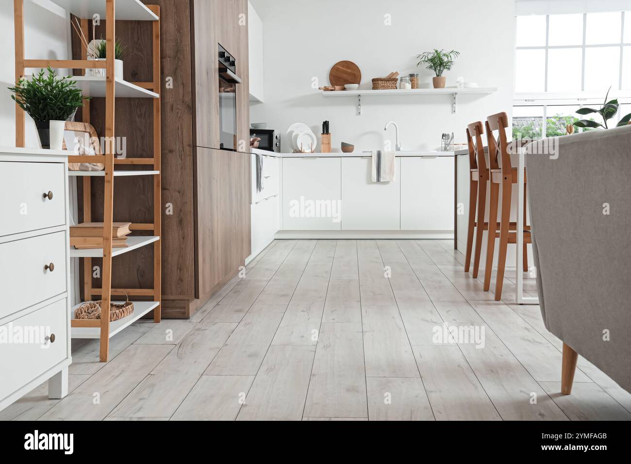 Interior of light kitchen with white counters and shelf unit Stock ...