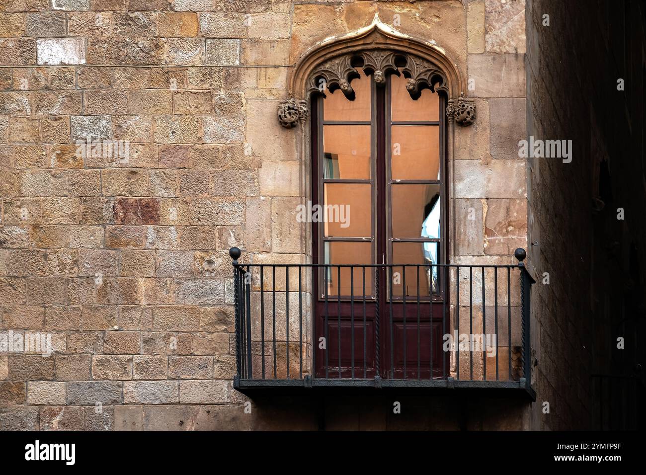 Balcony with cast iron railings and rectangular balcony door with ...