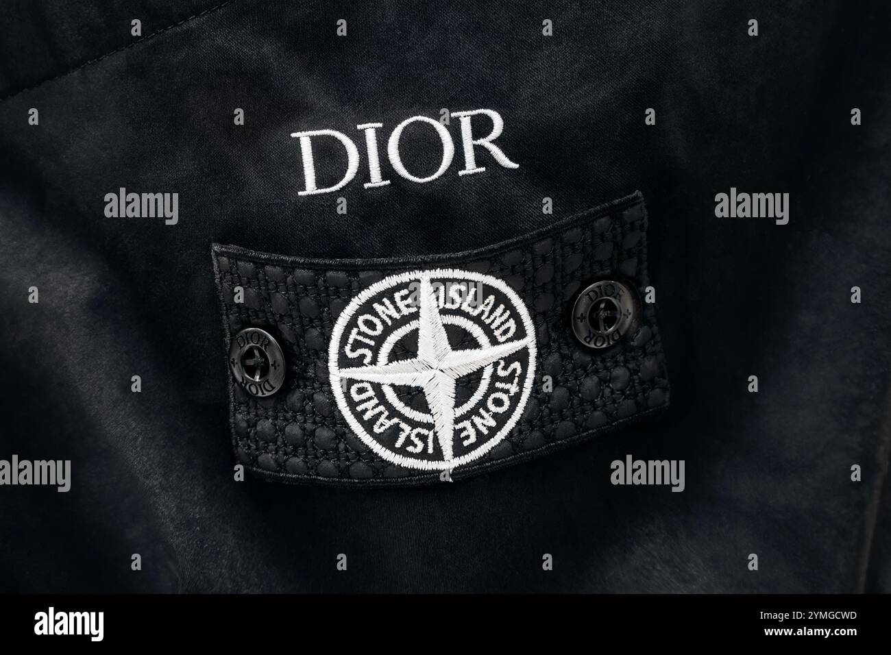 Milan, Italy - August 20, 2024: Close-up of the sleeve patch from the Dior x Stone Island collaboration Stock Photo