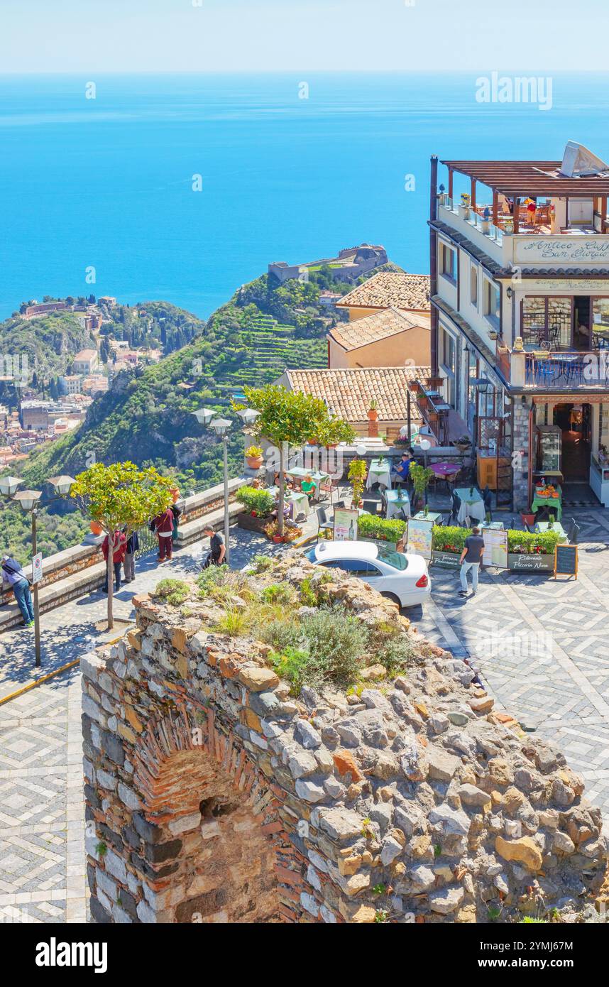 Taormina and the Ionian coast view from Castelmola main square, Castelmola, Taormina, Sicily, Italy Stock Photo