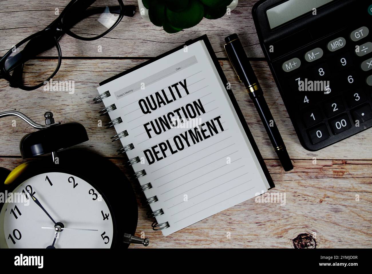 Quality Function Deployment (QFD) text on notepad, Business and ...