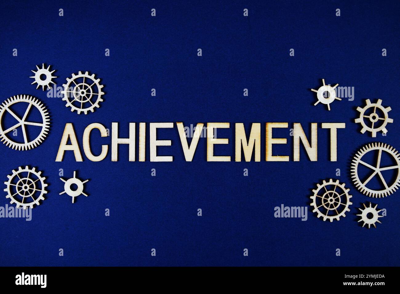 Achievement alphabet letters with gears element on navy blue background ...