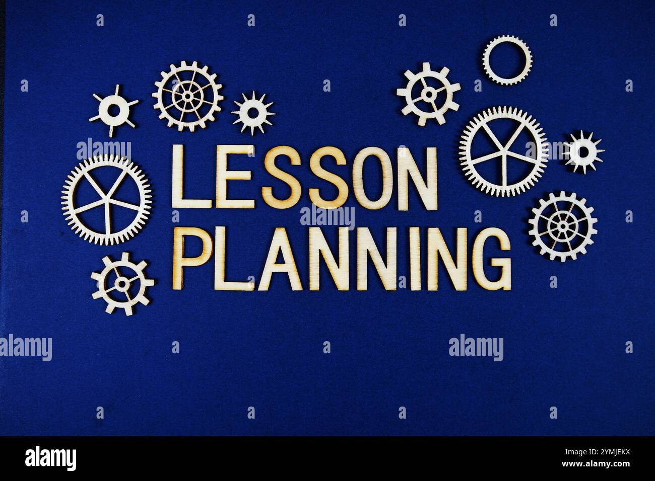 Lesson Planning alphabet letters with gears element on navy blue ...