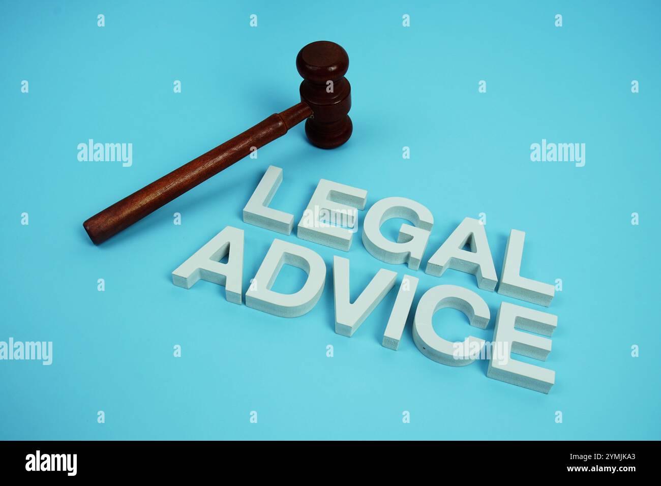 Legal Advice alphabet letters with wooden judge gavel on blue background Stock Photo