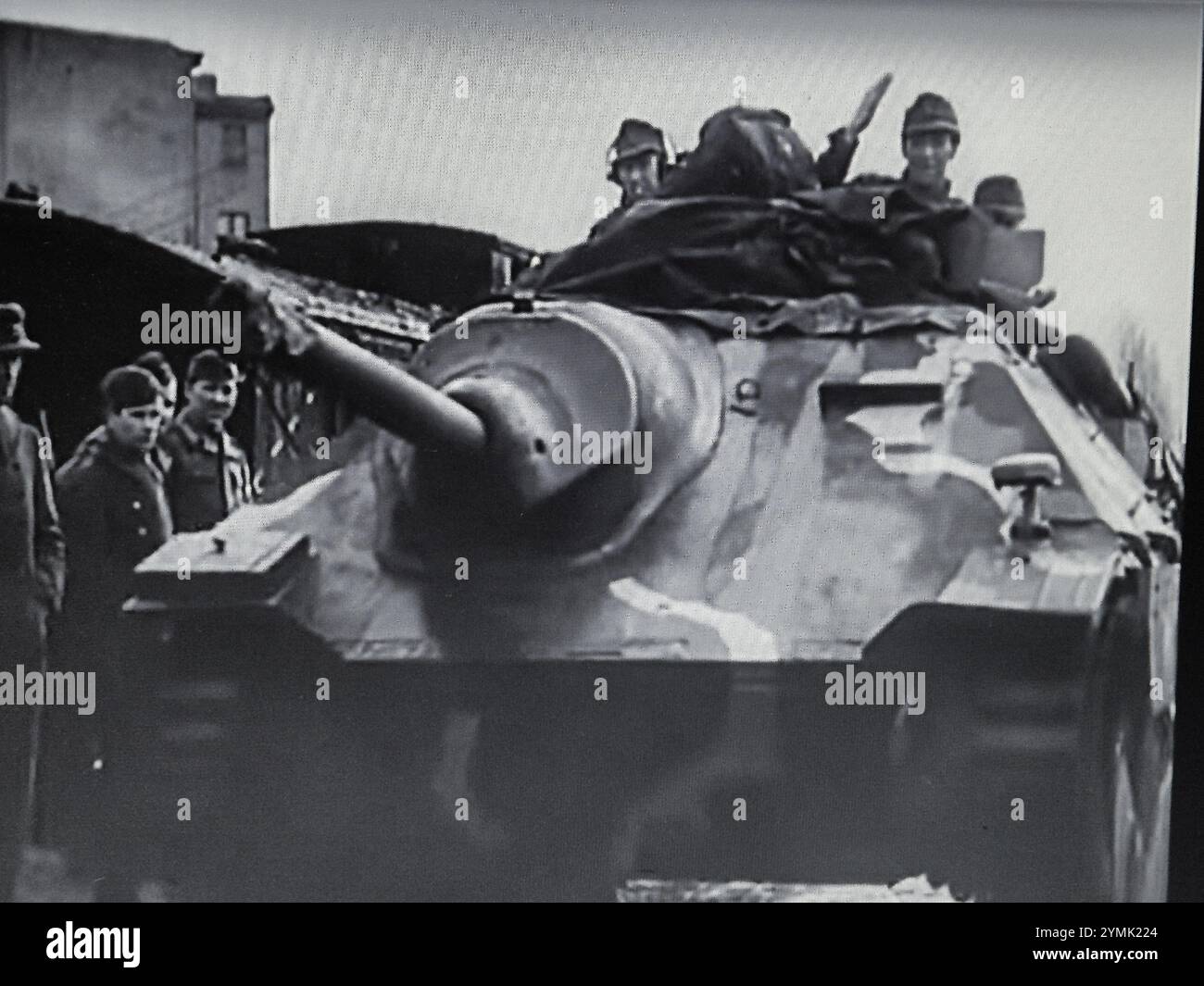 World War Two B&W photo A Hetzer advances, German Armour in 1945 was limited to only a few tanks and Assault Guns but there were Hetzer Tanks which had a low profile and a 75mm Gun they proved to be effective against the lighter Soviet Tanks.... Stock Photo