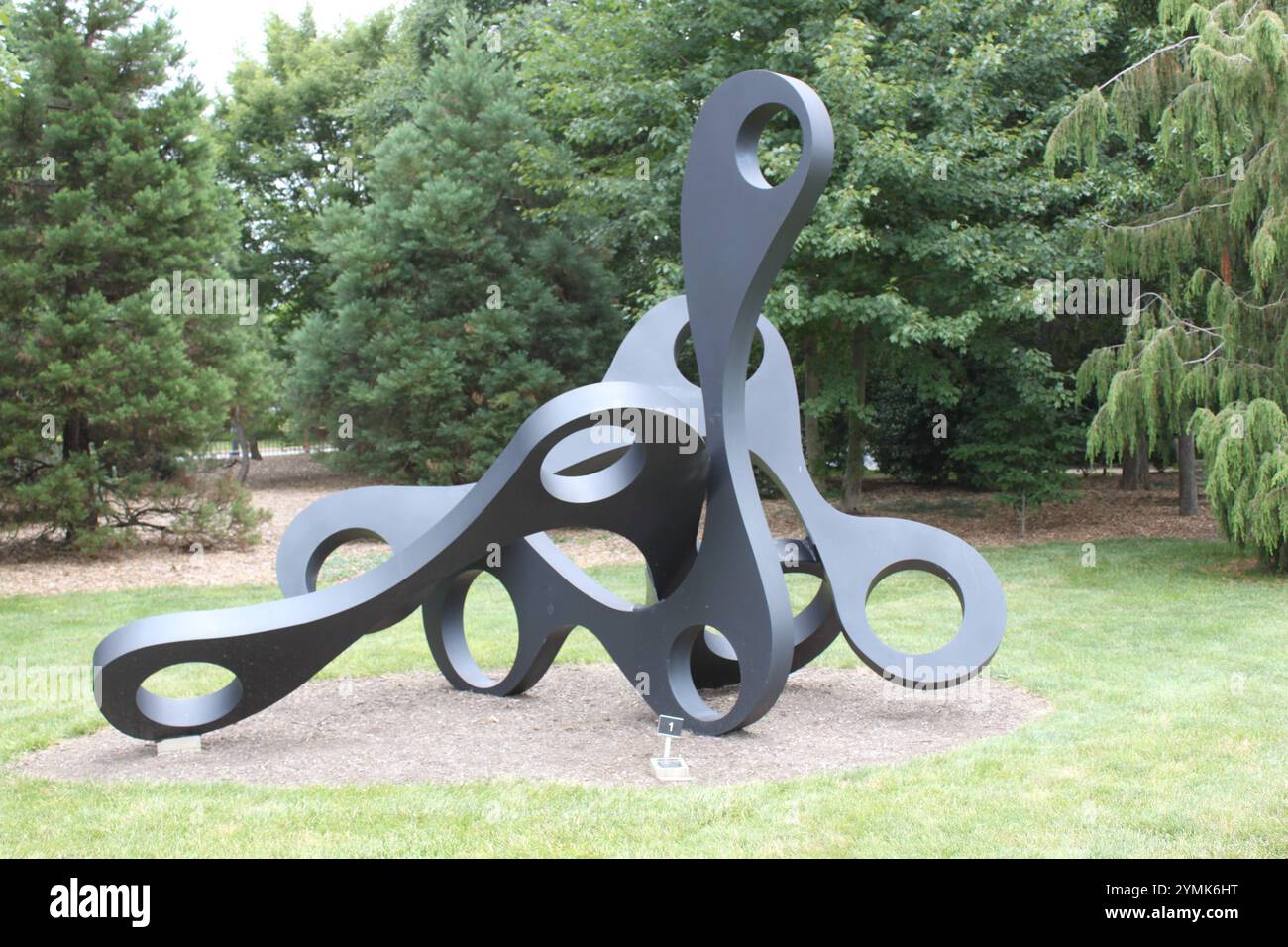 dark-gray-abstract-sculpture-with-multiple-interconnected-loops-and