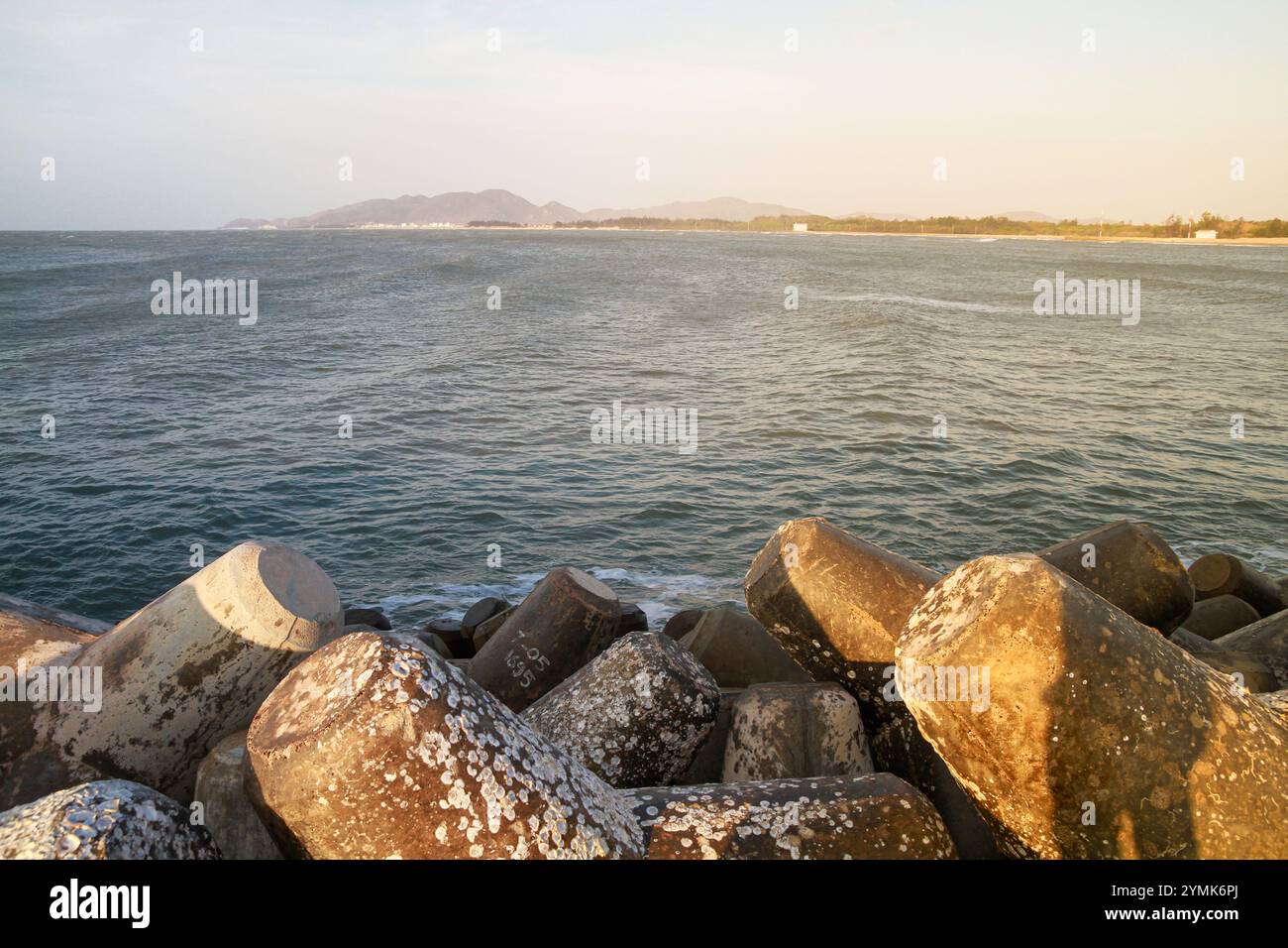 Loc An Stone Embankment - Loc An beach, in Loc An commune, Dat Do district, about 50 km from Vung Tau city center, Vietnam - 2024 Stock Photo