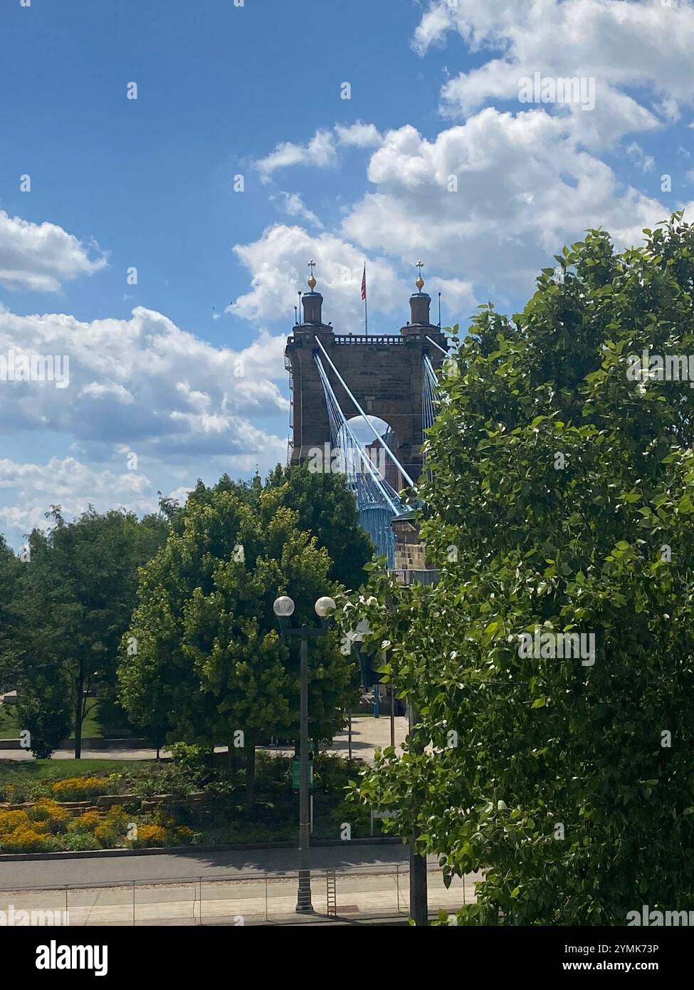 The John A. Roebling Suspension Bridge spans the Ohio River between Cincinnati, OH and Kentucky from the KY side - Smartphone Captured Stock Image