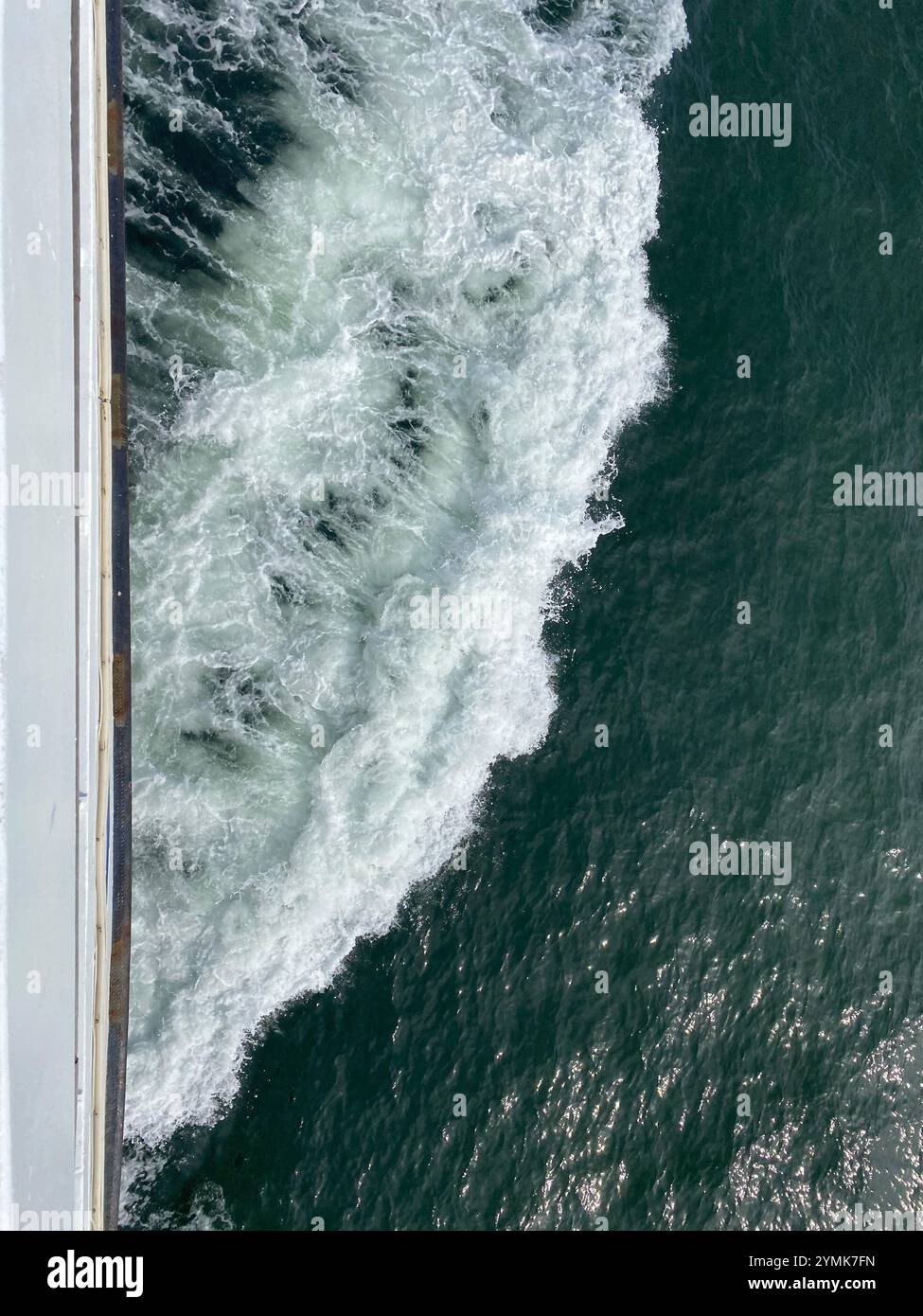 View from the deck of a boat at the wake produced by the ship Stock Photo