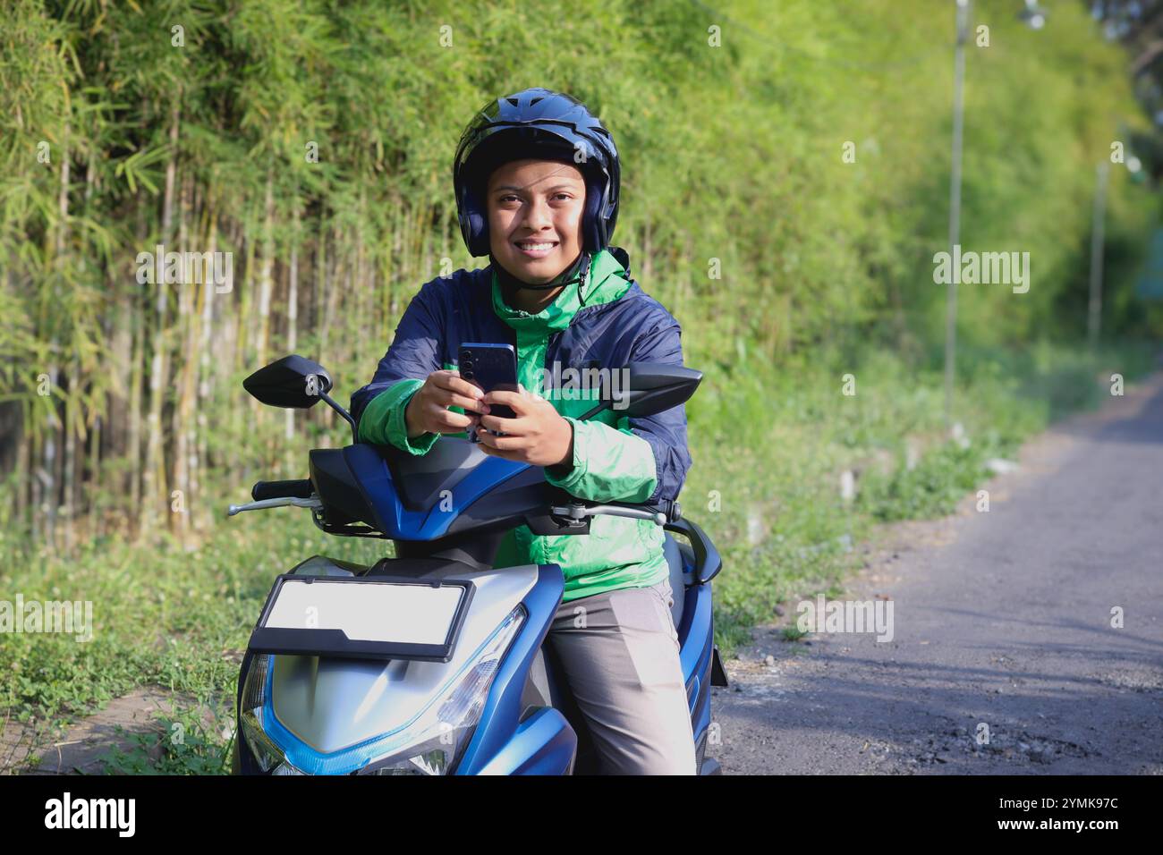 Vietnamese delivery rider hi-res stock photography and images - Alamy