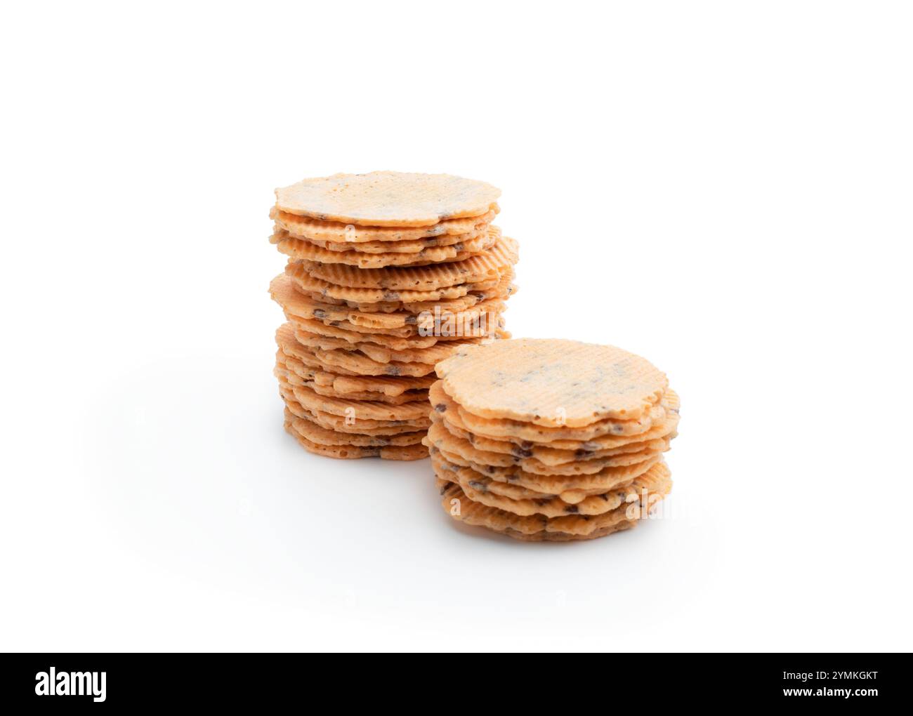 Stack  of thin round crispbreads with herbs isolated on white Stock Photo