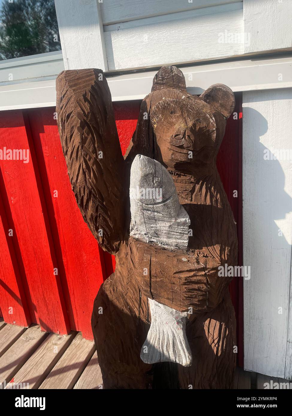 Wooden figurine of a bear fishing, Finnish Lapland - Smartphone Captured Stock Image