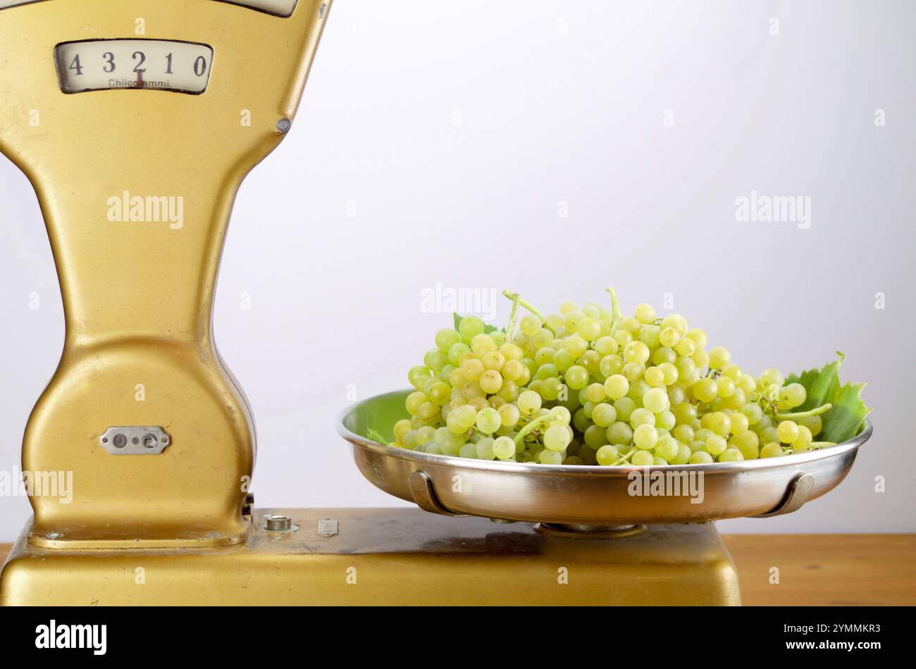 Two kilograms of muscat grapes on vintage balance Stock Photo