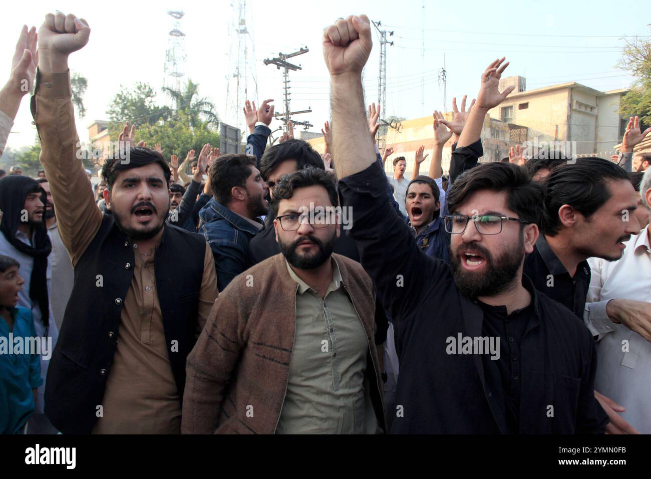 Shiite Muslims chant slogans to condemn the killing of Shiite Muslims ...