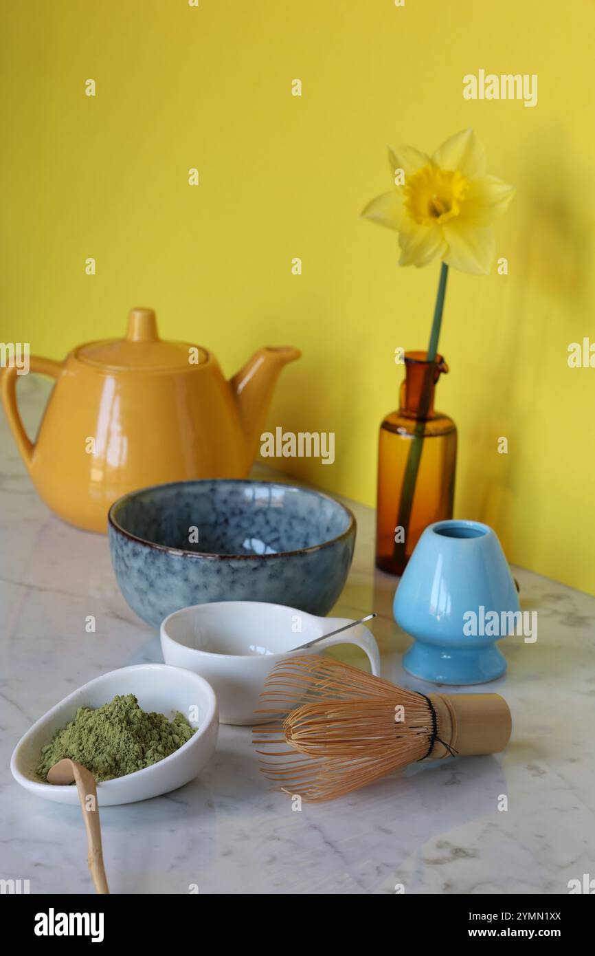 tea set for matcha on marble table, yellow background Stock Photo
