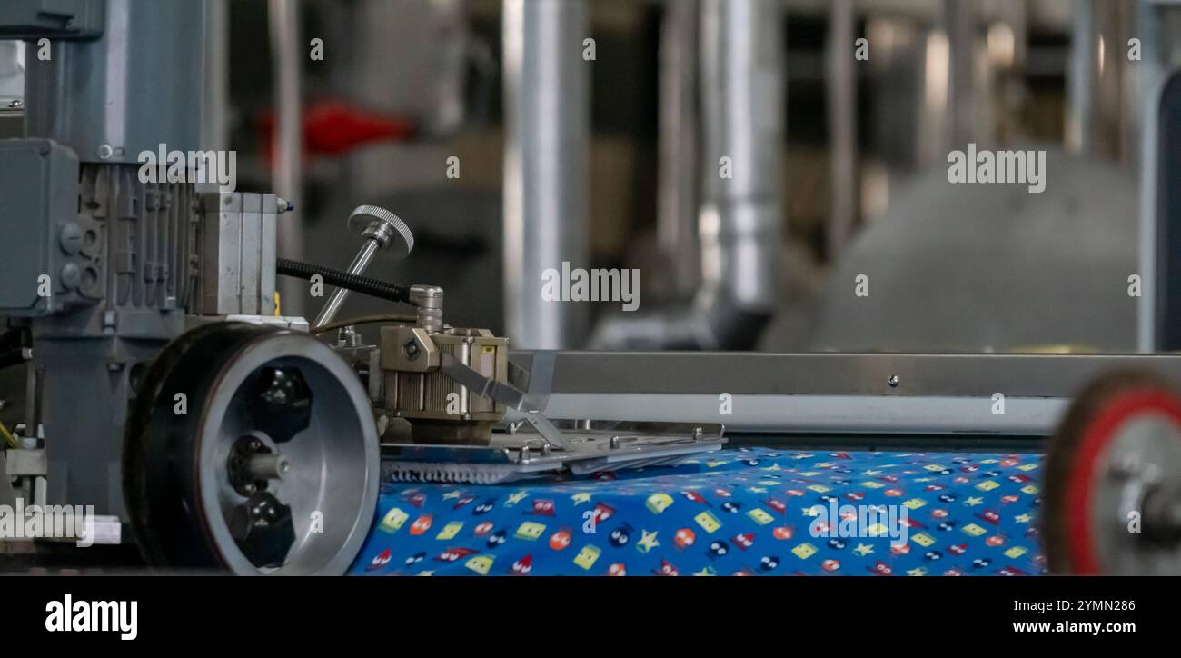 Fabric machine industrial plant line in a textile factory Stock Photo ...