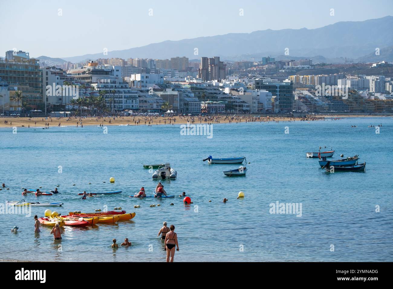 Gran Canaria, Canary Islands, Spain, 22nd November 2024. Tourists, mainly British and German, bask on the city beach in Las Palmas as unusually high November temperature reaches 32 degrees Celsius. Credit: Alan Dawson/Alamy Live News. Stock Photo