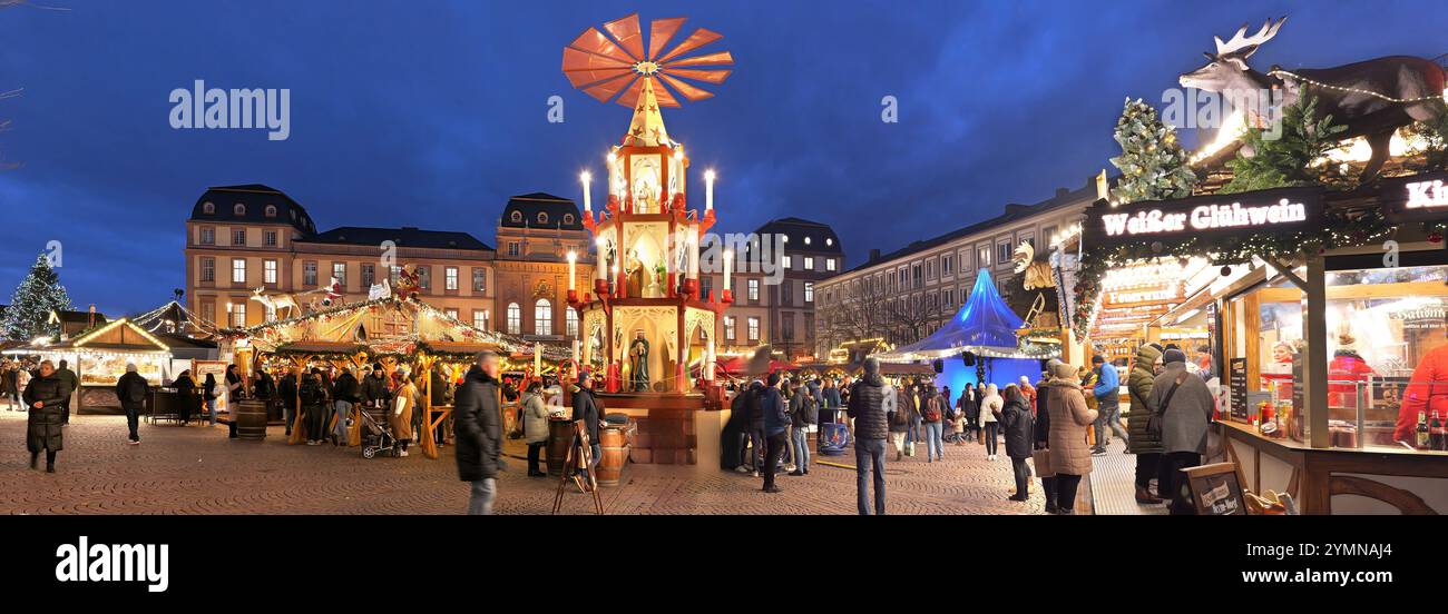 Darmstadt, Germany, 20.11.2024: Christmas market with Pyramid , Christmas decorations and Christmas huts with beautiful lighting. Traditional German Stock Photo