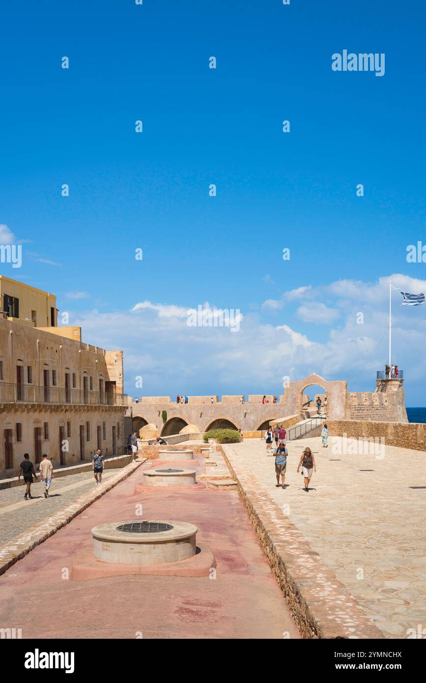 Chania Naval Museum, view in summer of people exploring the old Venetian naval garrison - or Firkas - behind the Naval Museum, Chania harbour, Crete Stock Photo