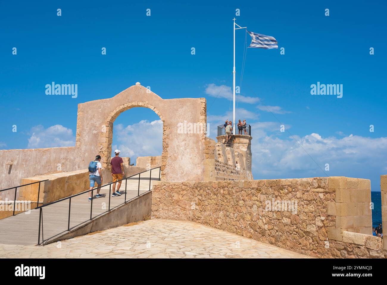 Chania Naval Museum, view in summer of people exploring the old Venetian naval garrison - or Firkas - behind the Naval Museum, Chania harbour, Crete Stock Photo