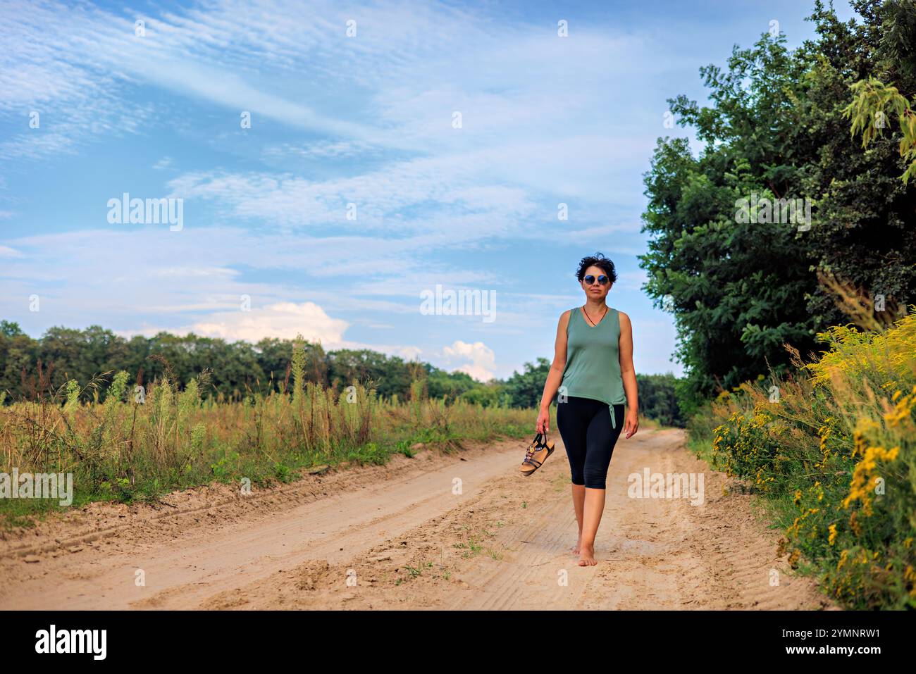 Barefoot grass walking hi-res stock photography and images - Alamy
