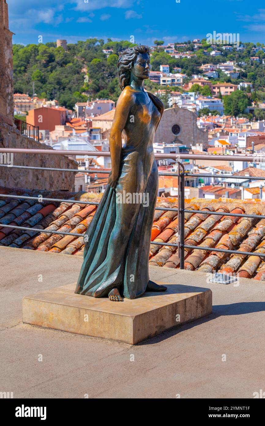 Tossa de Mar, Spain - September 11, 2014: The statue of Ava Gardner towers over the rooftops of Tossa de Mar. The bronze sculpture is located just out Stock Photo