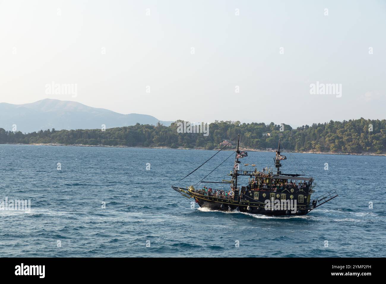 The tourist pirate ship The Black Rose, returns to port after a tour of the island at Corfu, Greece Stock Photo