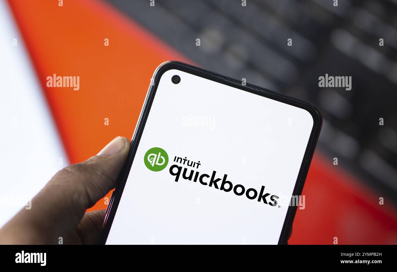 Intuit quickbooks logo is displayed on smartphone. QuickBooks is an accounting software. Stock Photo