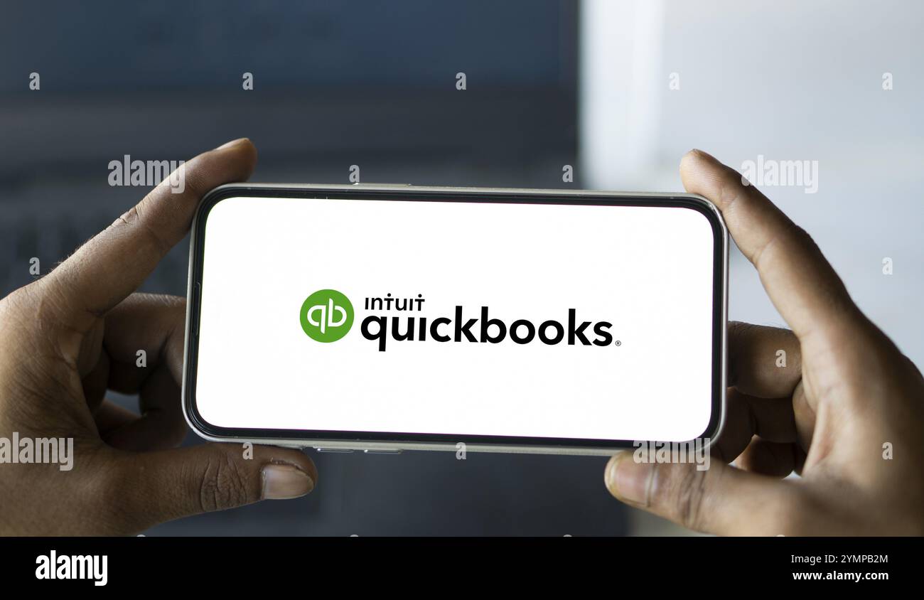 Intuit quickbooks logo is displayed on smartphone. QuickBooks is an accounting software. Stock Photo