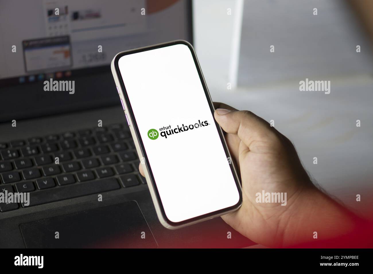 Intuit quickbooks logo is displayed on smartphone. QuickBooks is an accounting software. Stock Photo