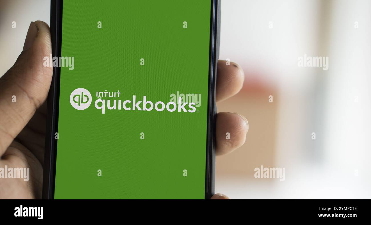Intuit quickbooks logo is displayed on smartphone. QuickBooks is an accounting software. Stock Photo