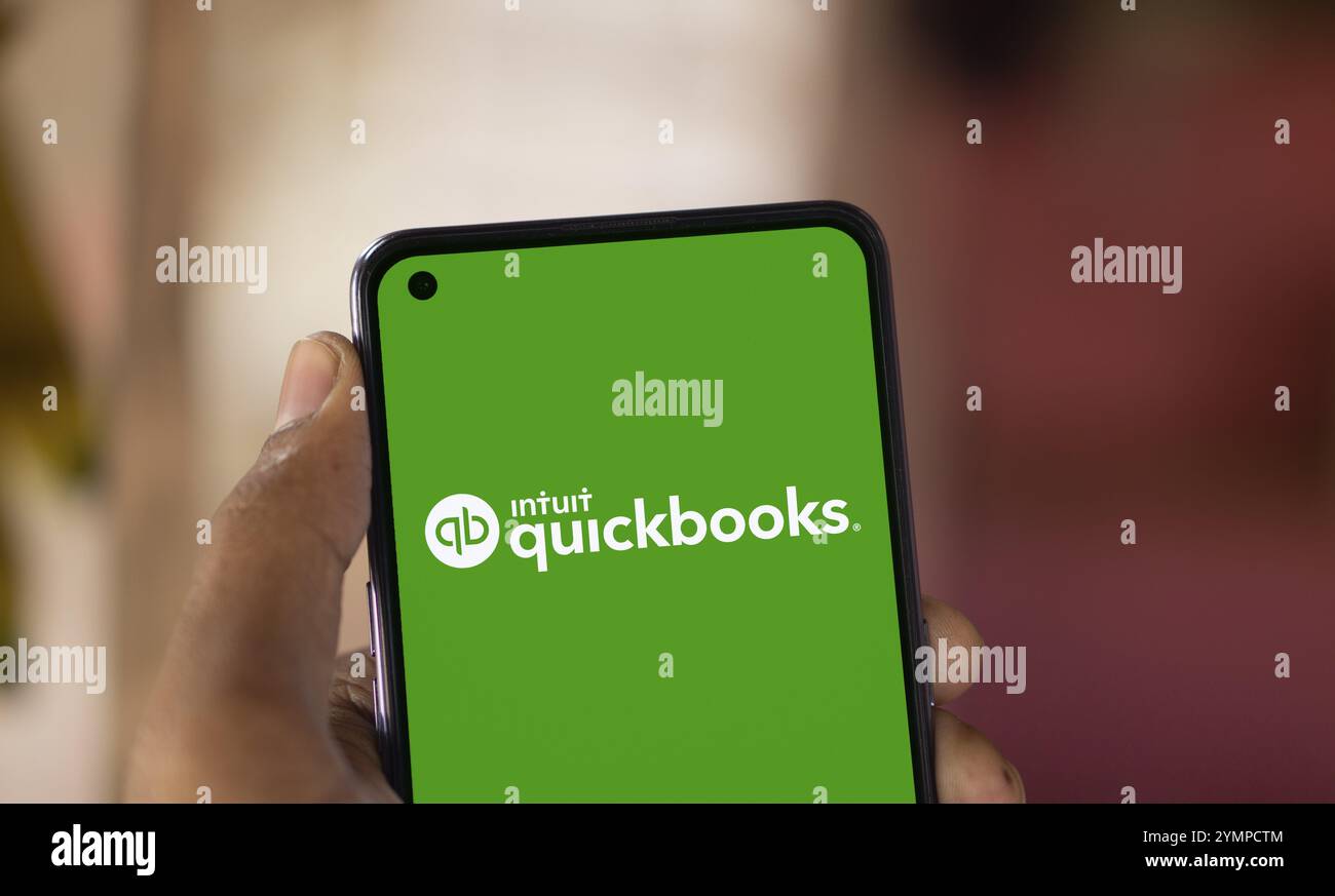Intuit quickbooks logo is displayed on smartphone. QuickBooks is an accounting software. Stock Photo