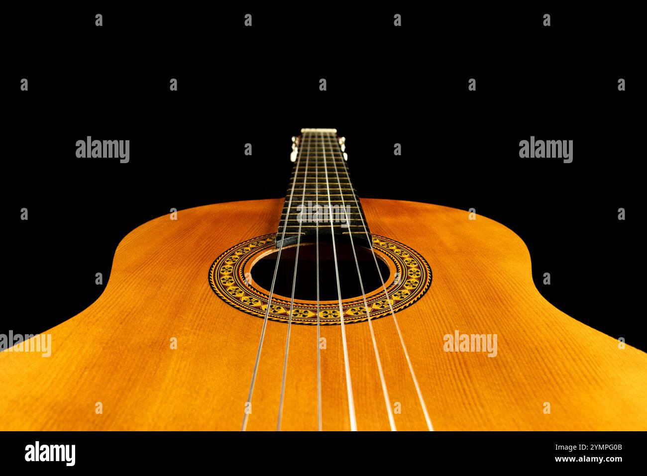Classical guitar black background sound hole strings showing Stock Photo