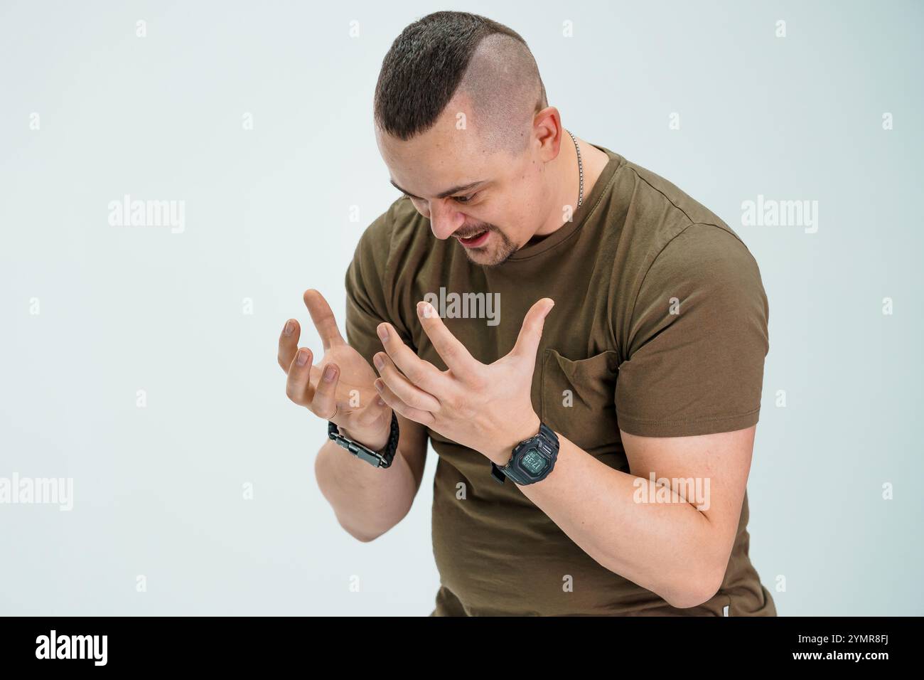 Man Expressing Emotion with Hands Raised. Stock Photo