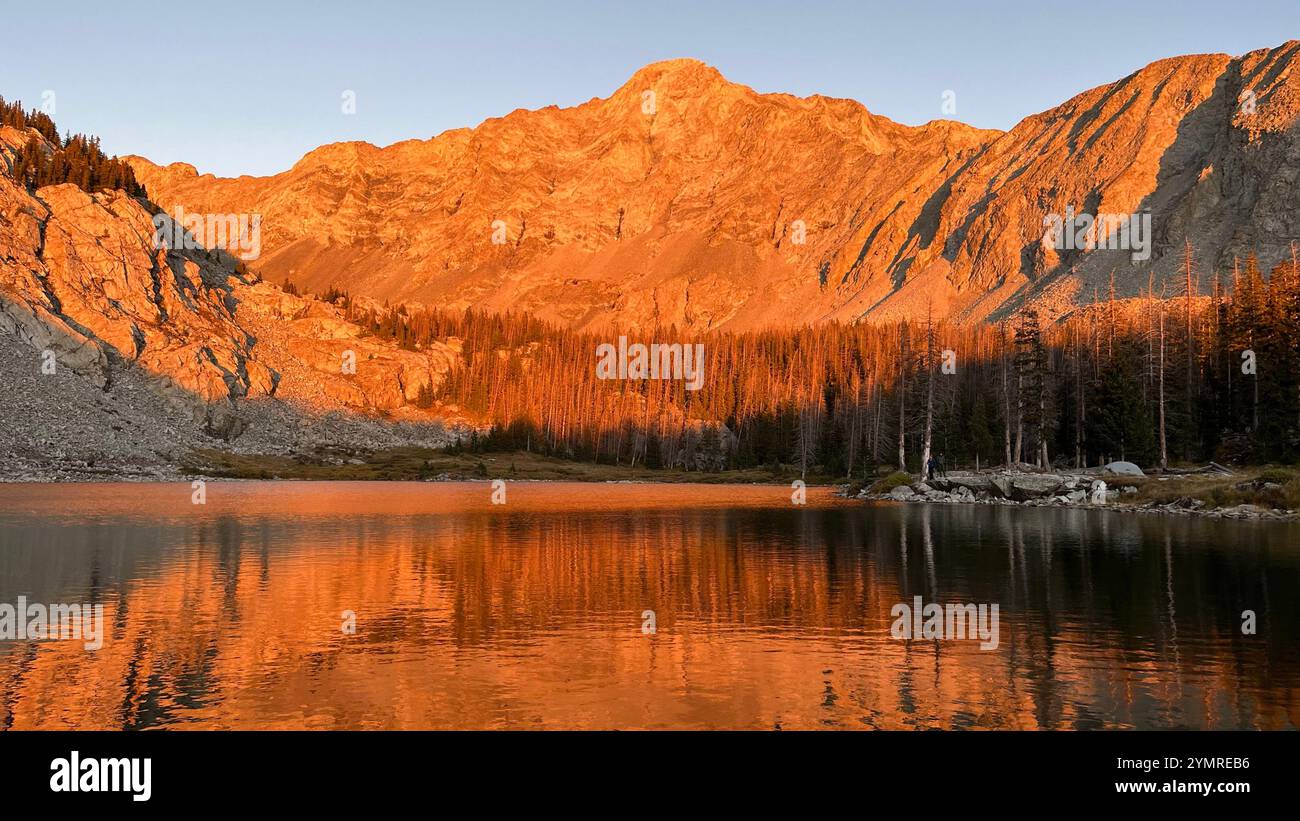 Golden Hour Sun Setting on Epic Mountain Peak - Smartphone Captured Stock Image