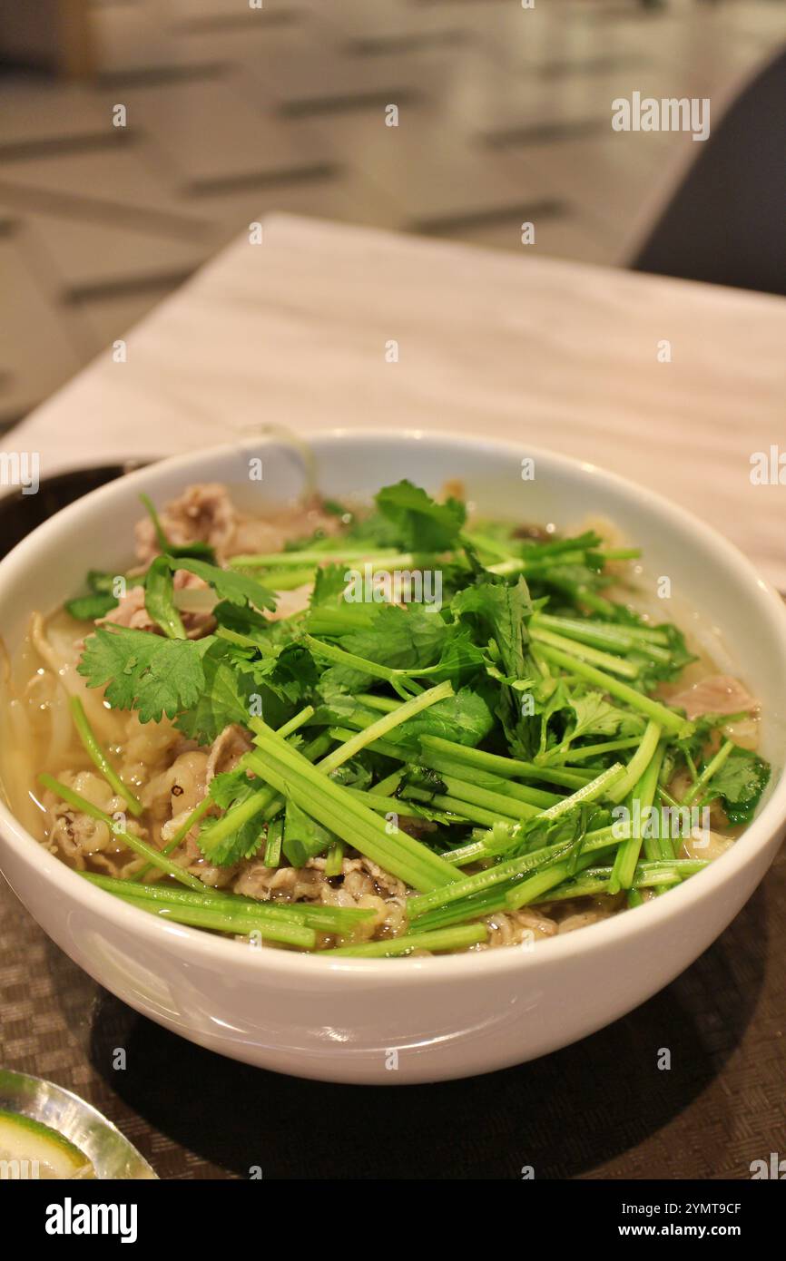 Vietnamese cuisine: pho bo (rice noodles with sliced beef and coriander ...