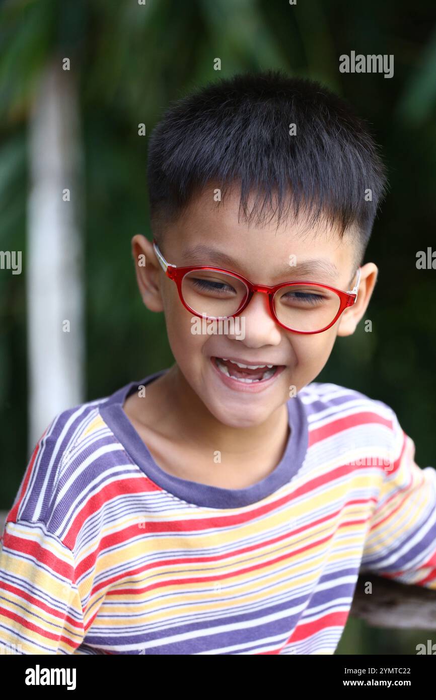 Wearing glasses smiles brightly hi-res stock photography and images - Alamy